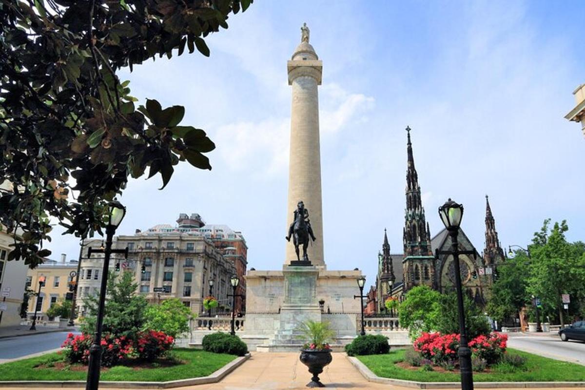 a monument in front of a building with a statue