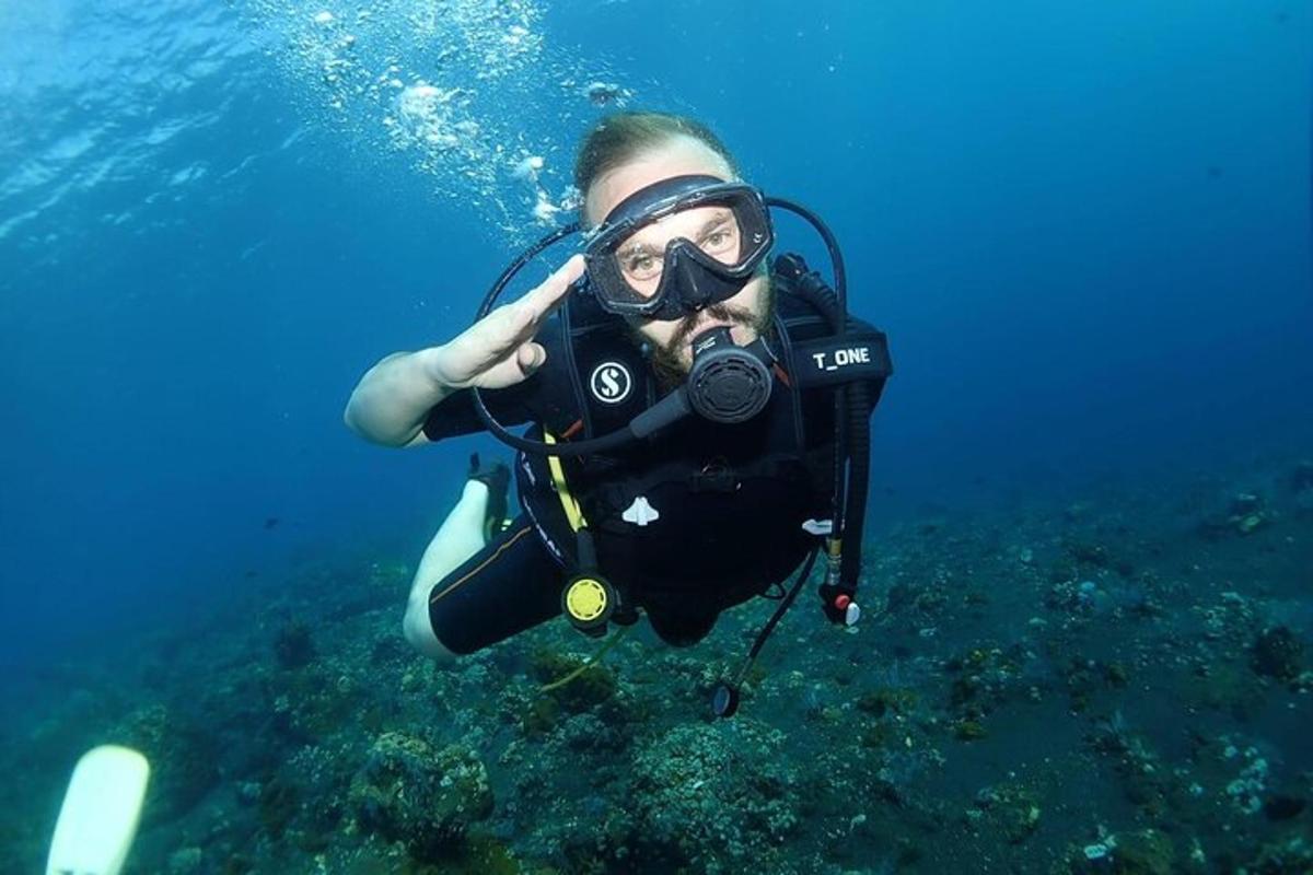 a person with a camera is underwater in the water