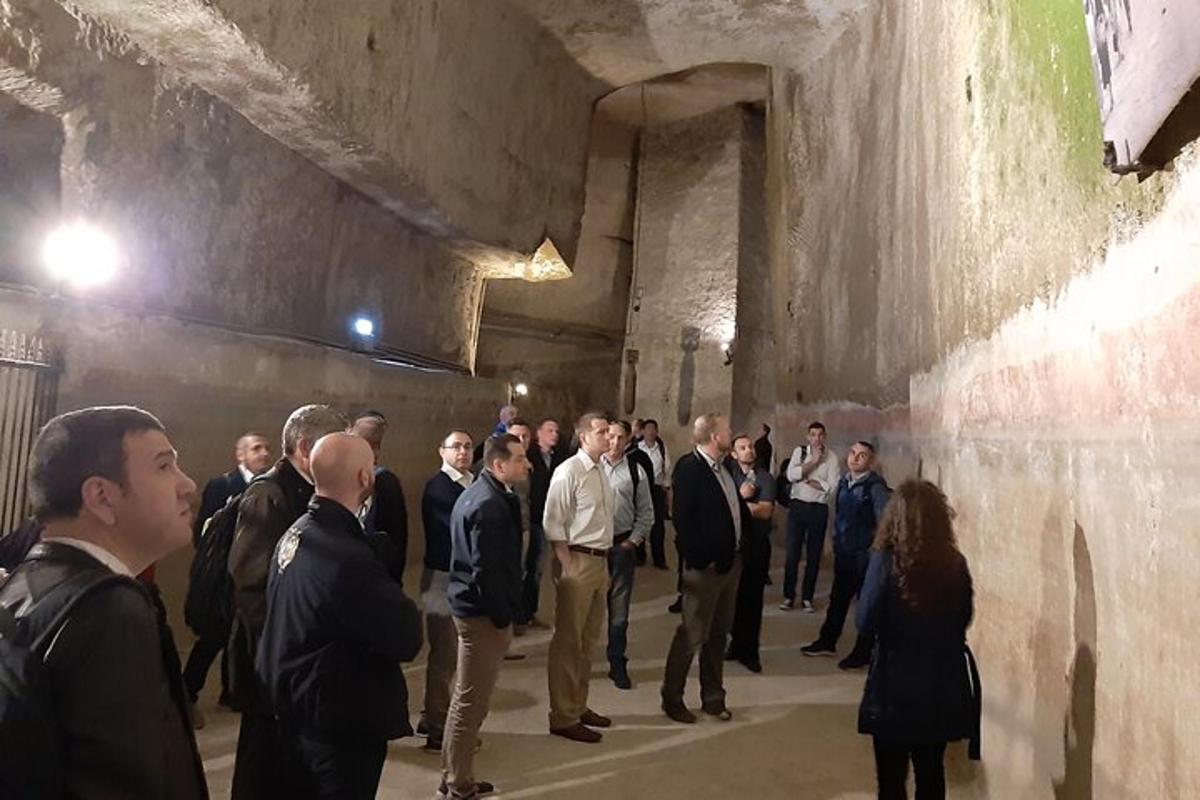 a large group of people standing in a tunnel
