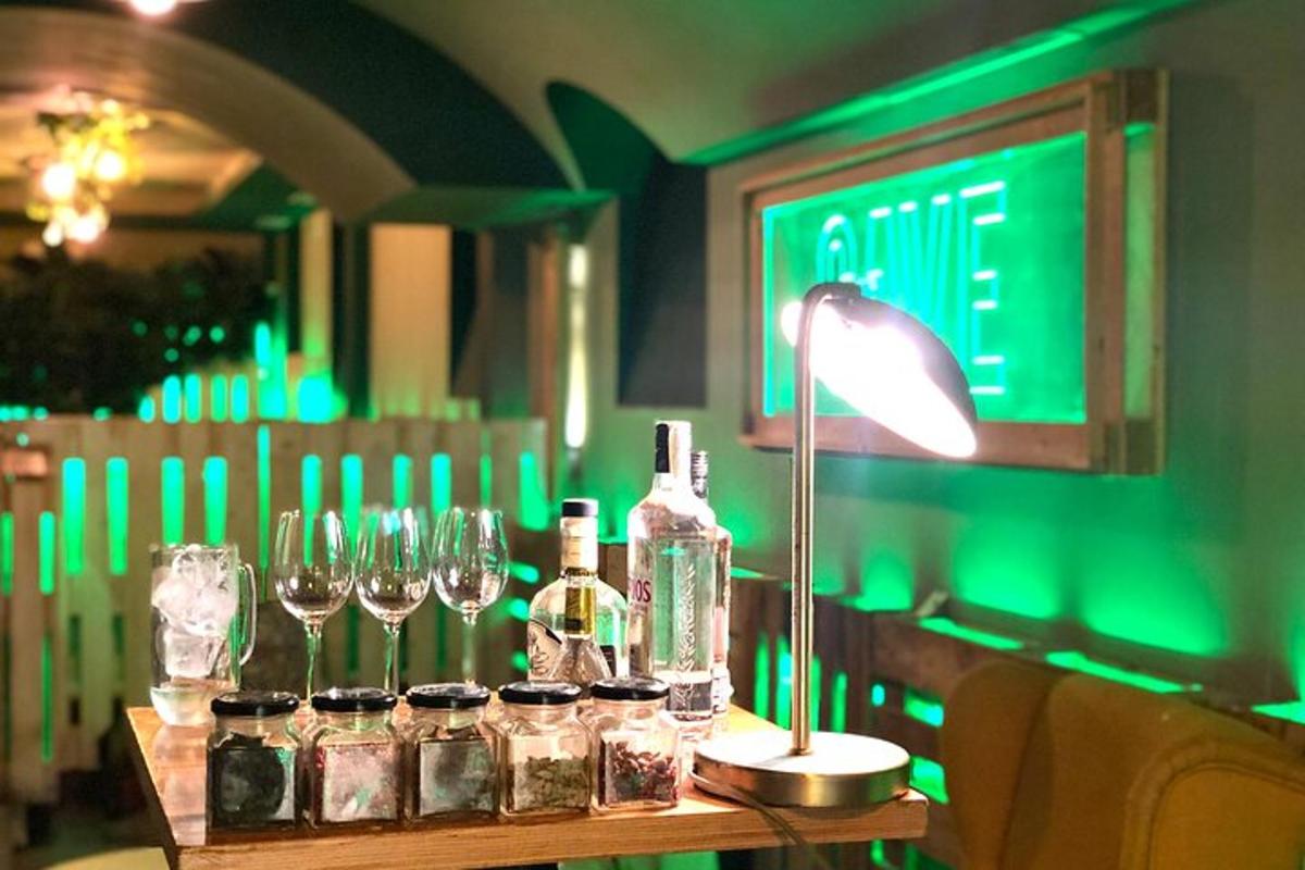 a table with wine glasses and a lamp on it
