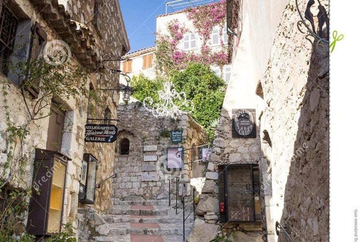 an alley in an old town with stone buildings