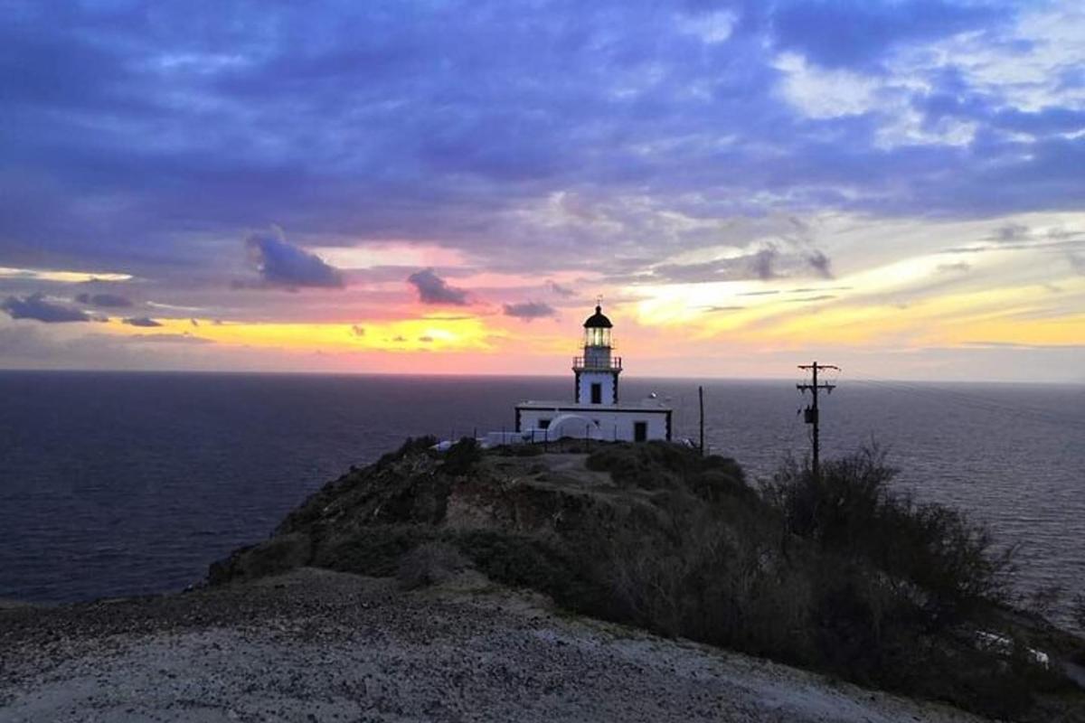 a lighthouse on a small island in the ocean