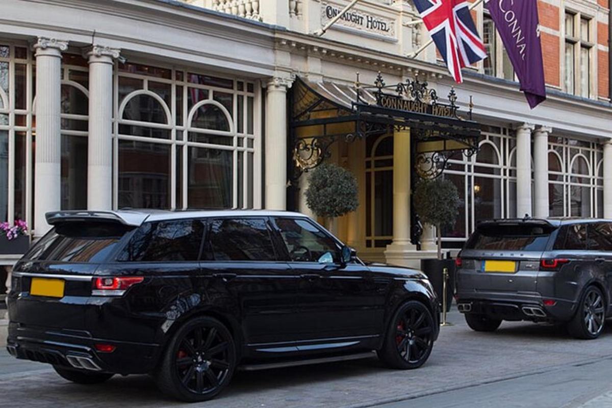 two cars parked in front of a building
