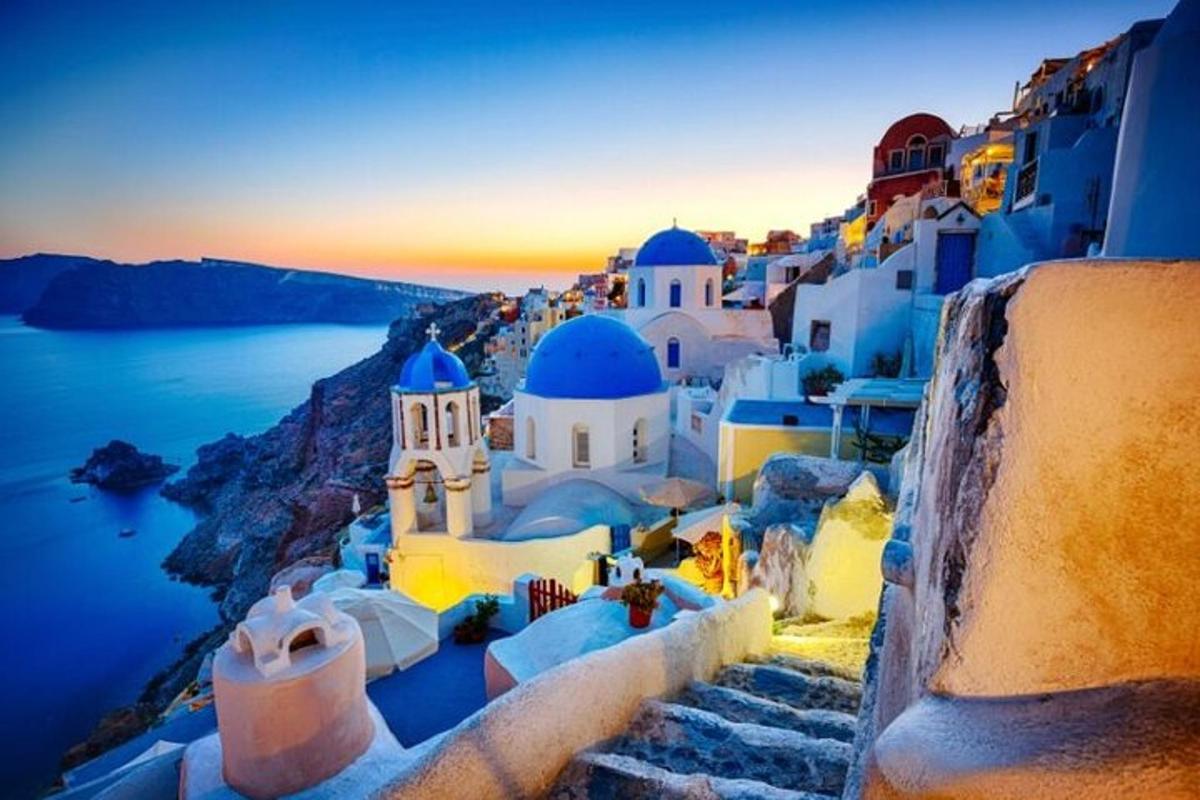 a group of buildings with blue domes and stairs