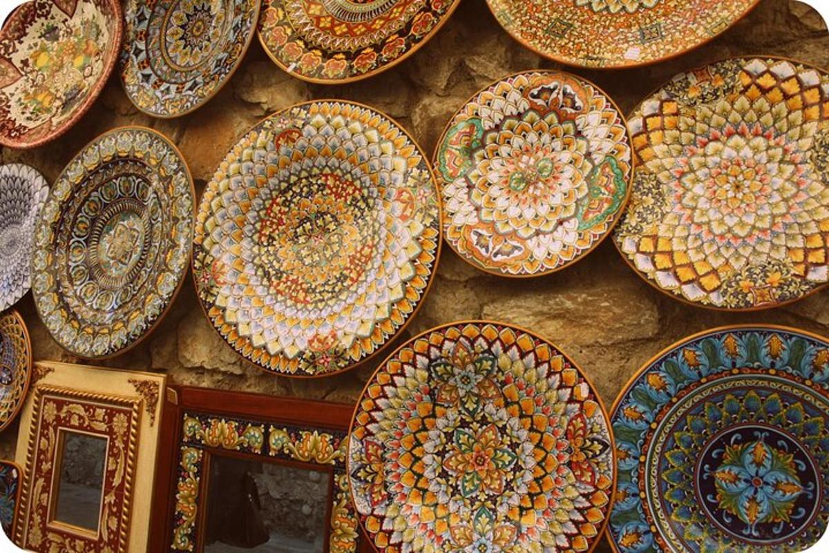 a bunch of plates hanging on a wall