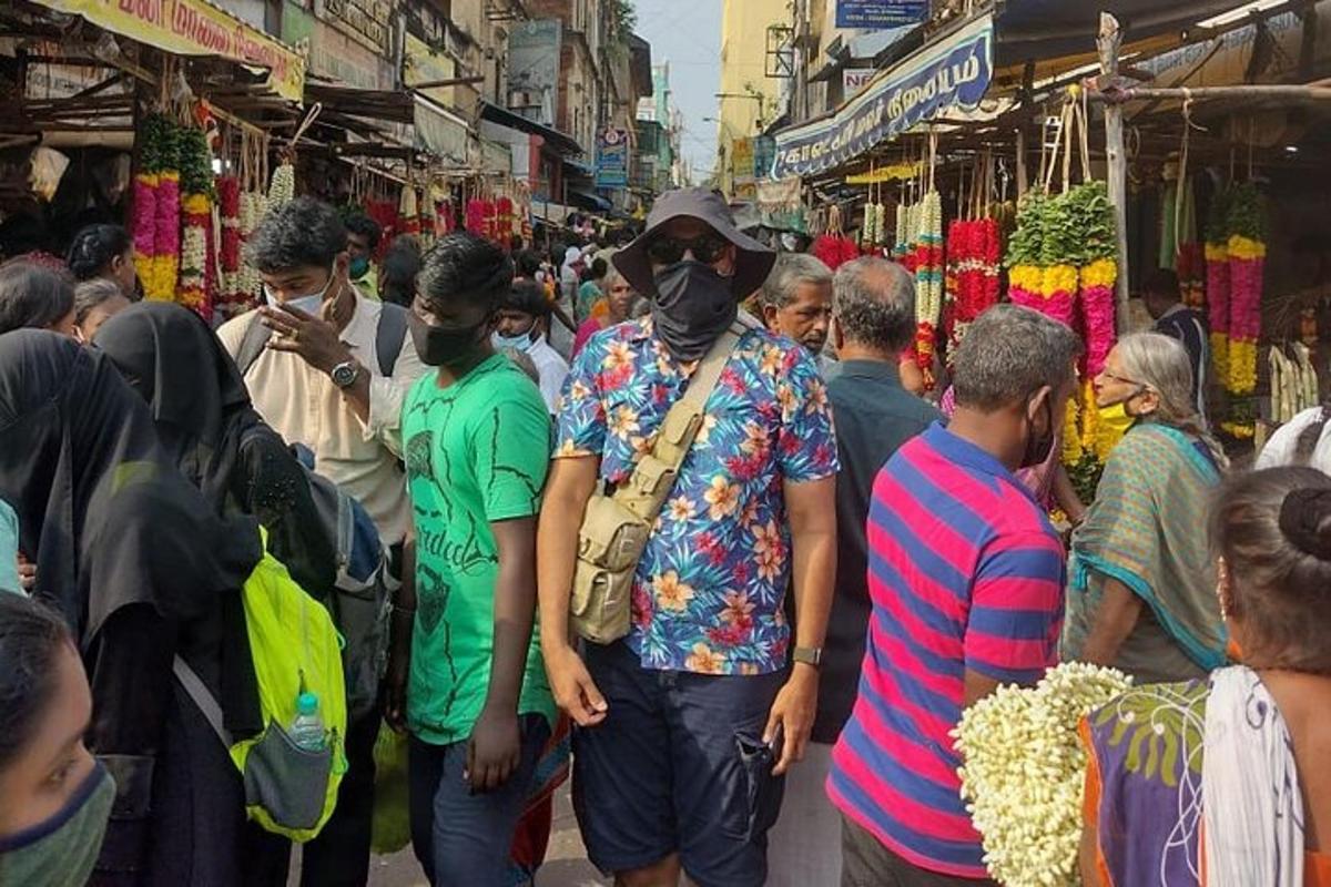 a group of people standing in a market