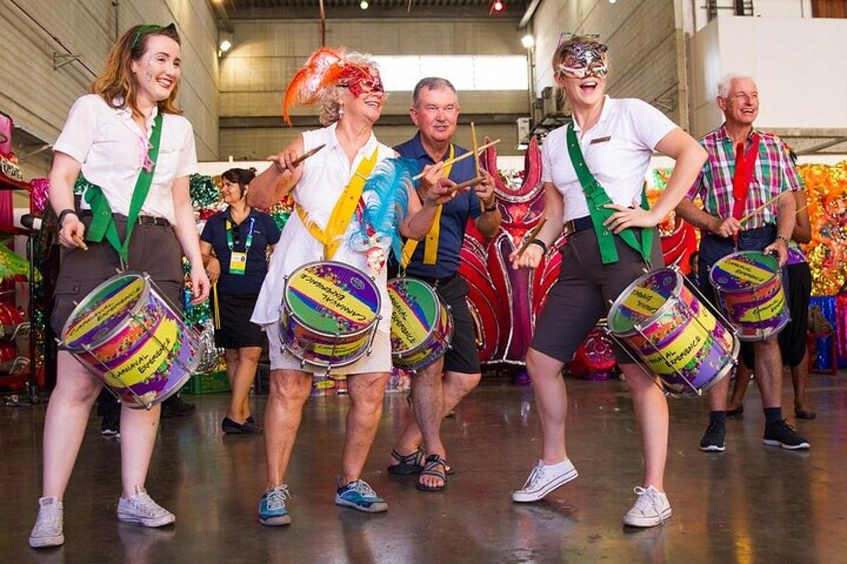 a group of people standing in a group with drums