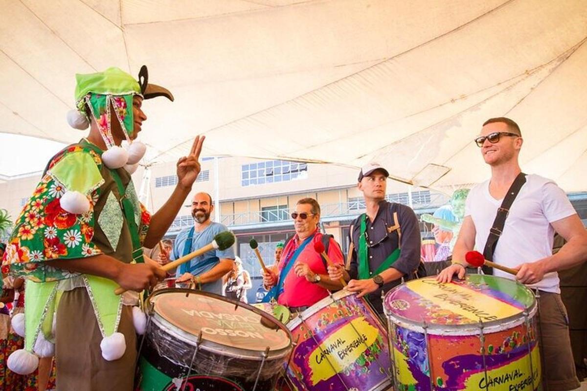 a group of men playing drums with a drummer