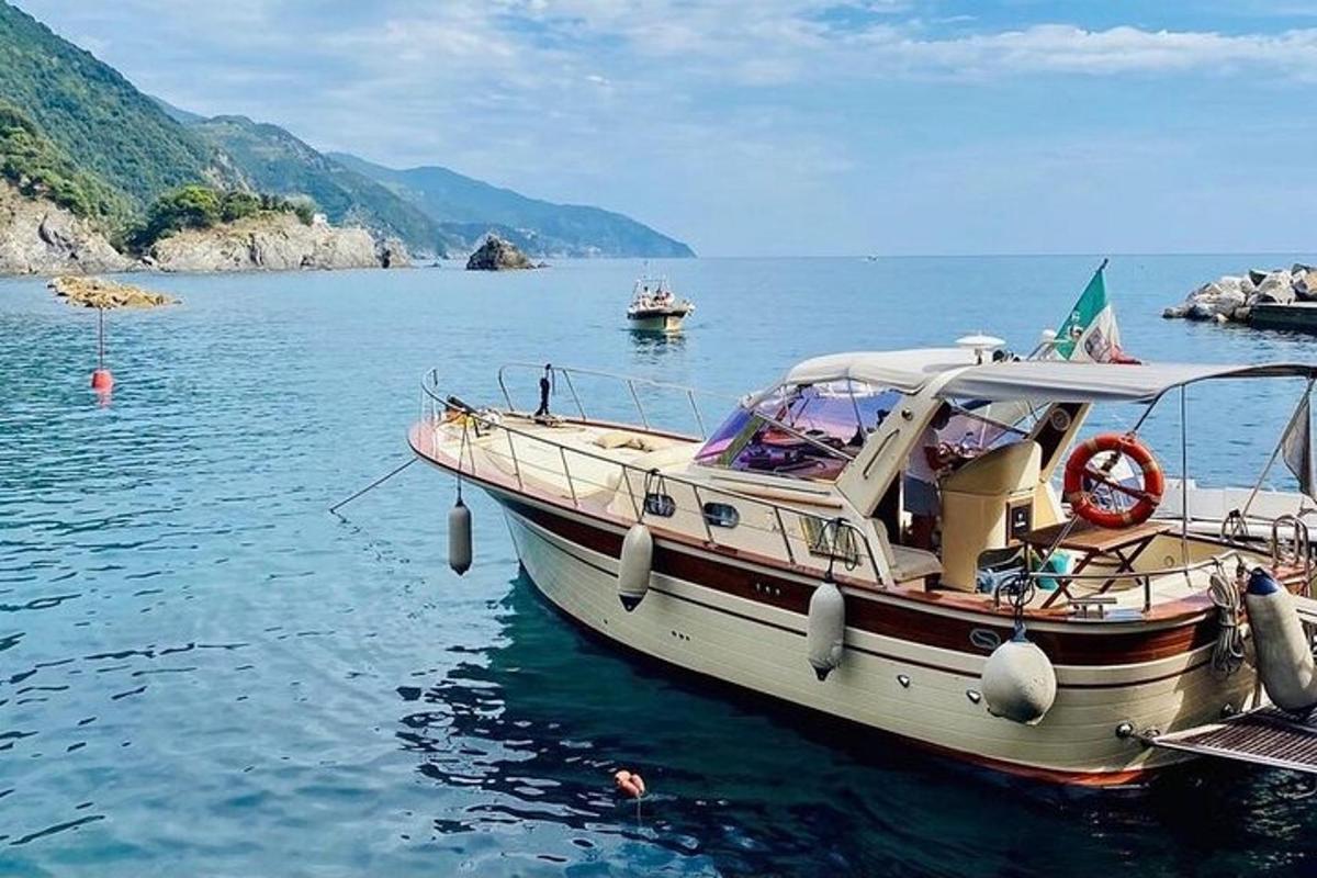 a boat is docked in the water on a lake
