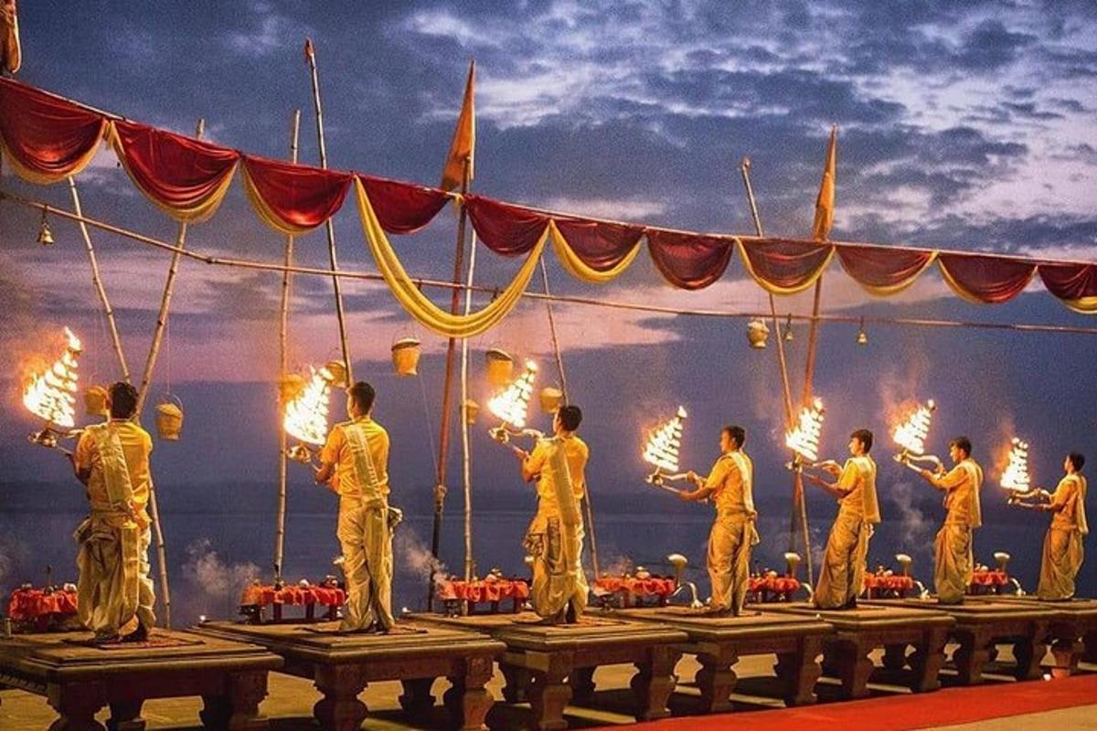 a group of people standing on a stage with torches