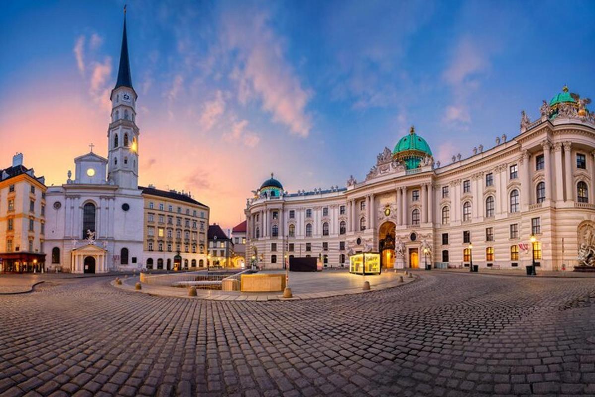 a large building with a clock tower in a city