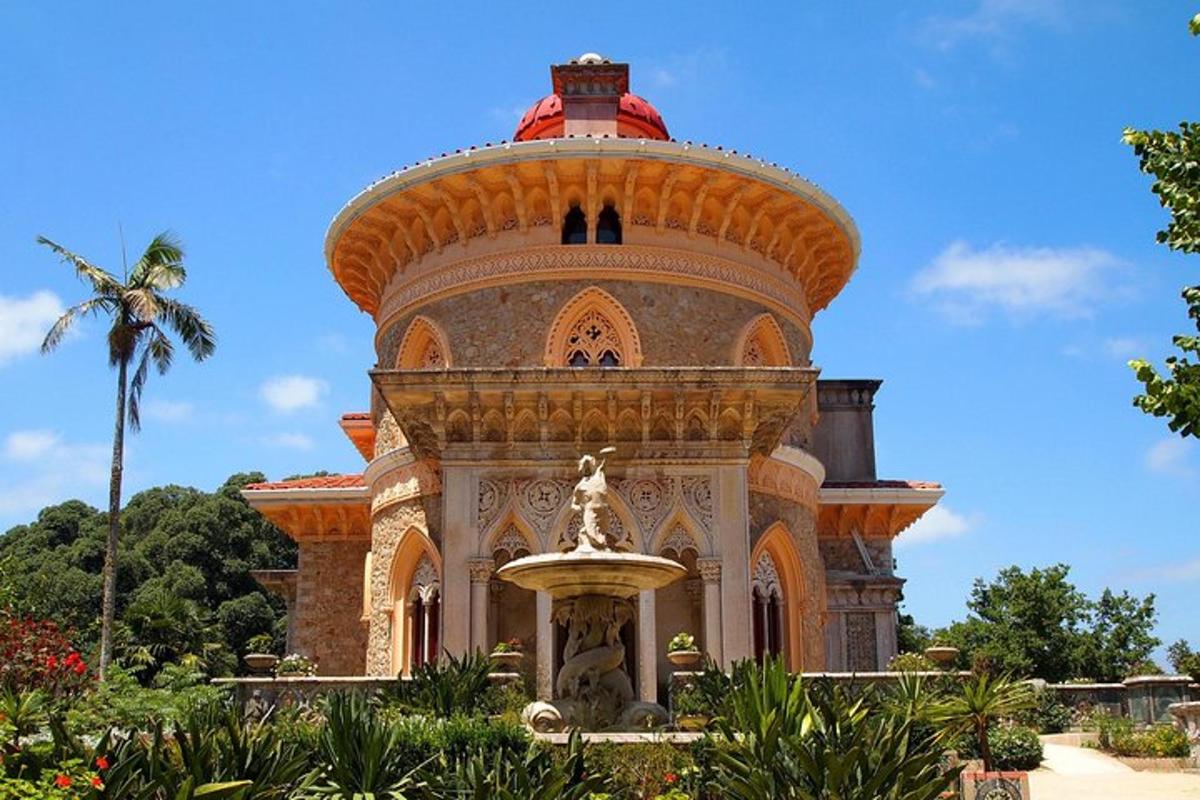 a large building with a fountain in front of it