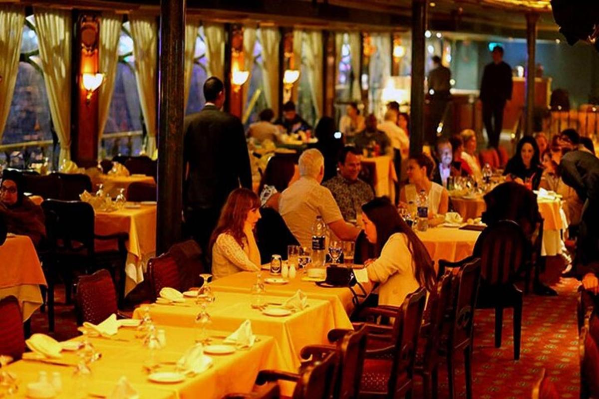 a group of people sitting at tables in a restaurant