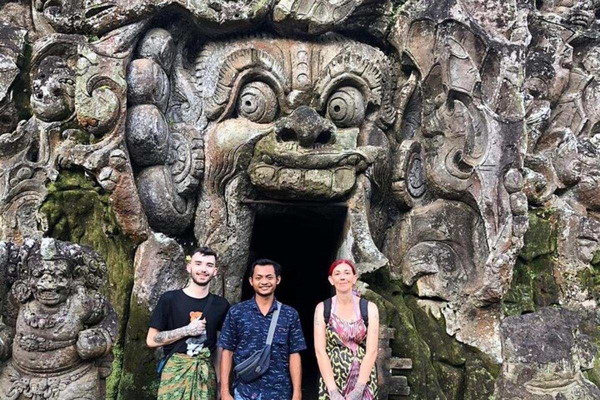a group of three people standing in front of a stone building