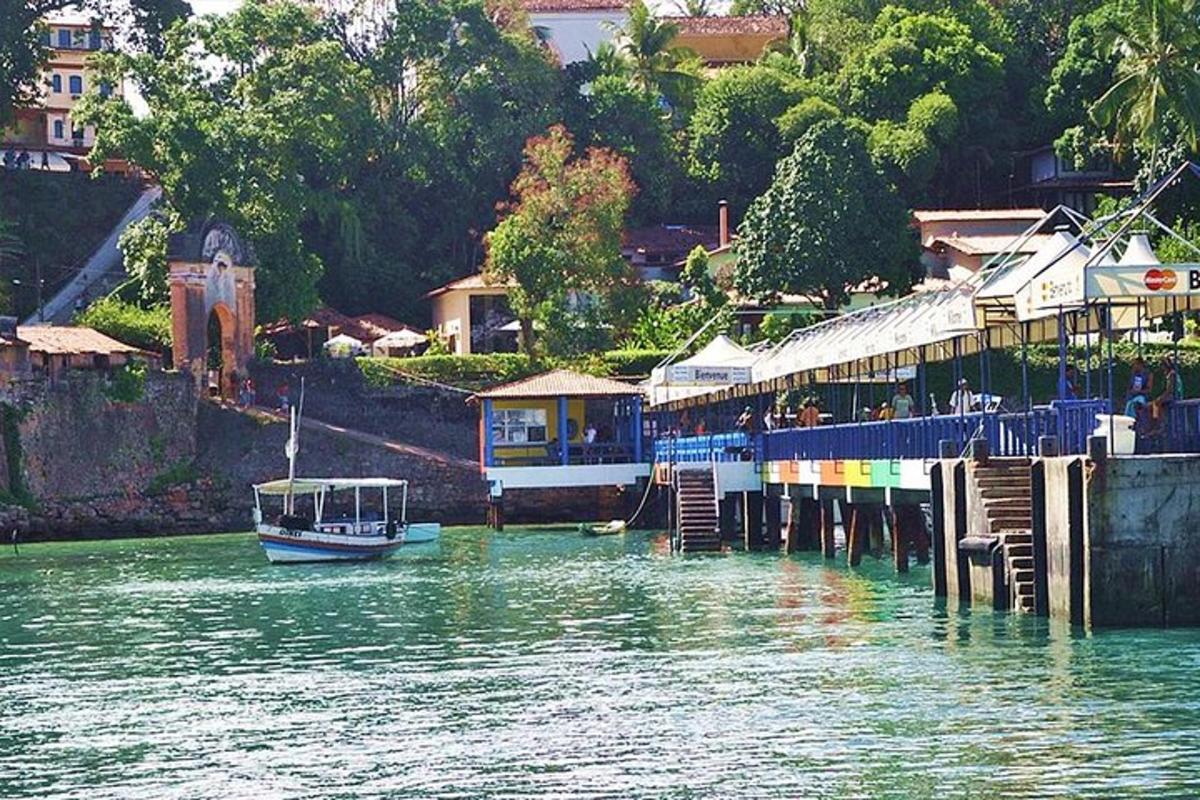 a boat is docked at a dock in the water
