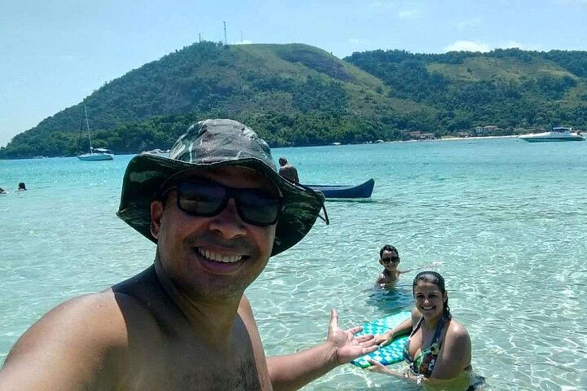 a man and woman in the water at the beach