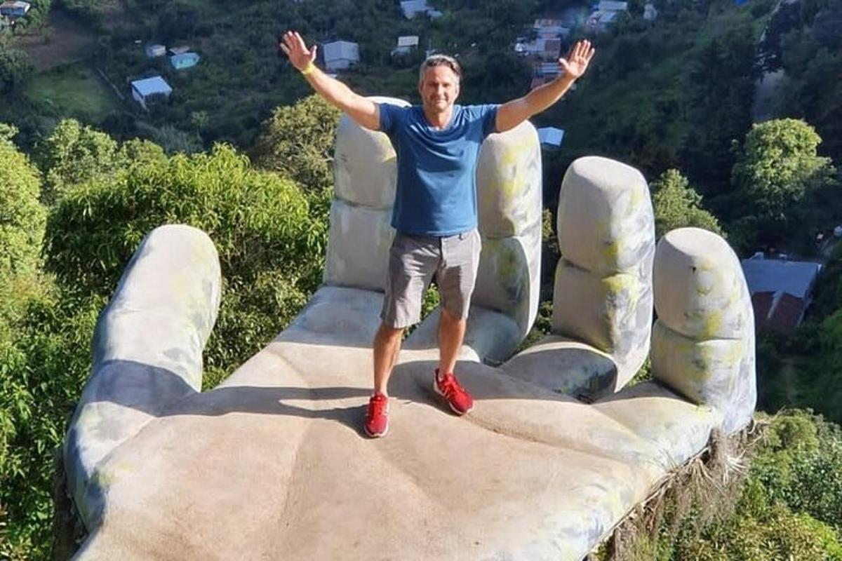 a man standing on top of a large couch