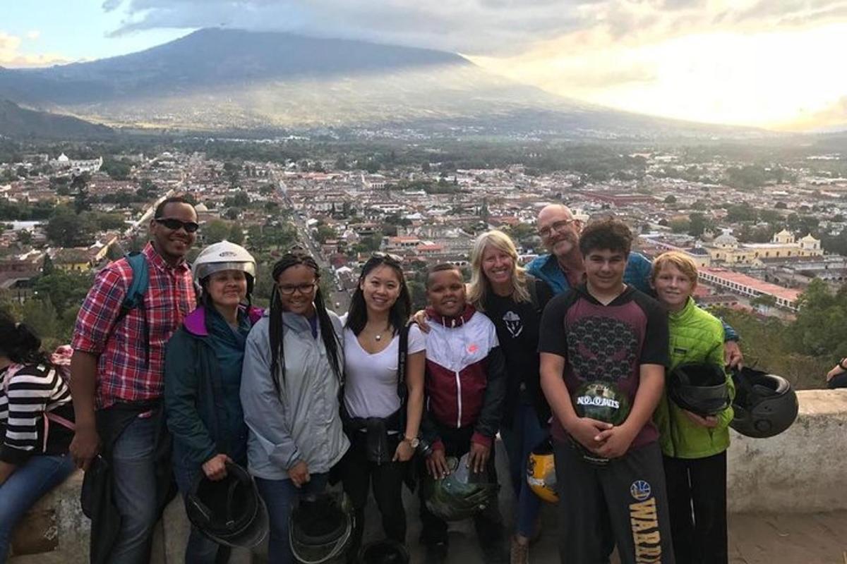 a group of people standing on top of a mountain