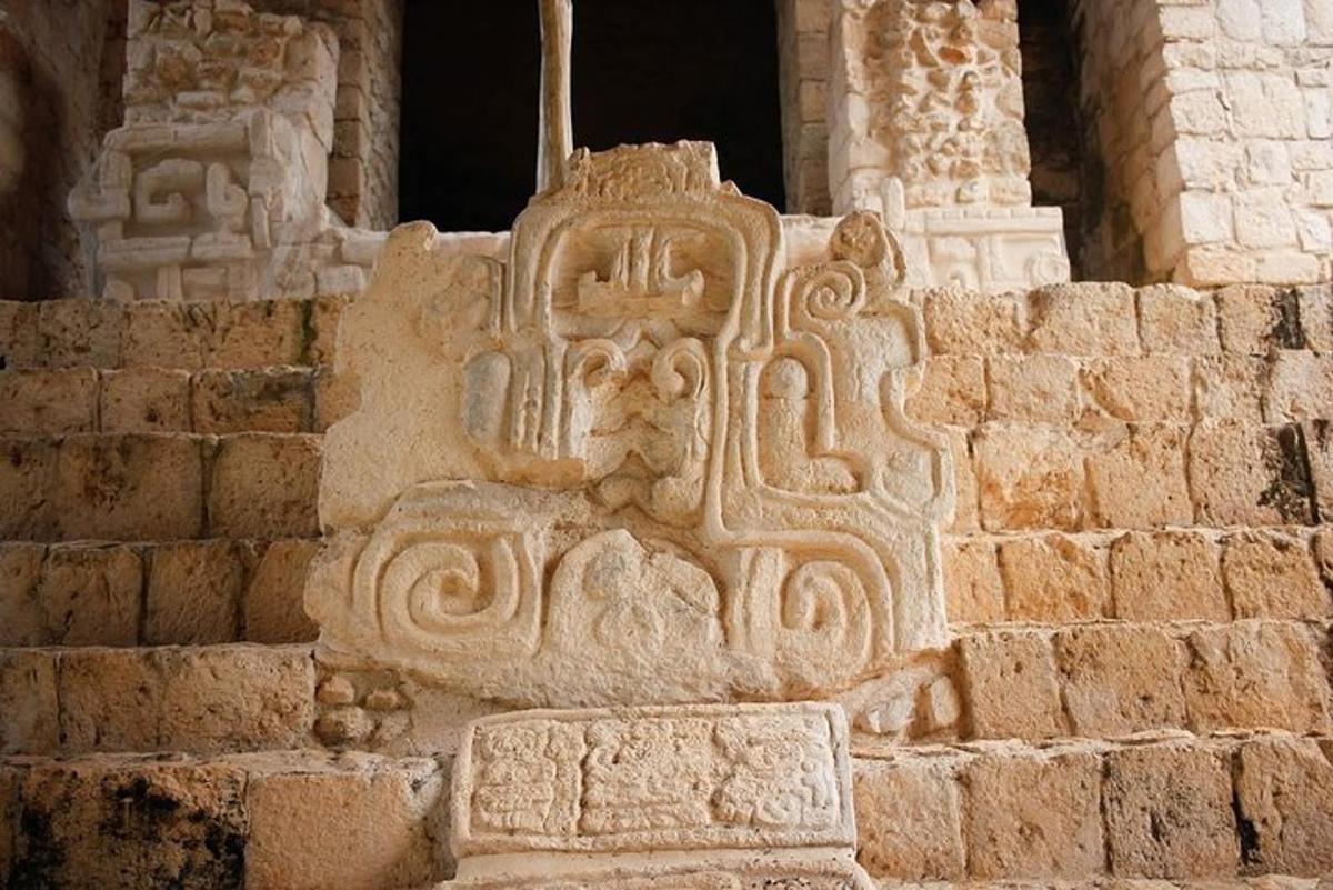 a stone building with a carving on the side of it