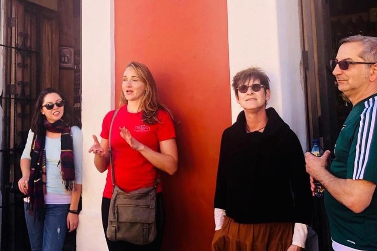 a group of people standing next to a wall