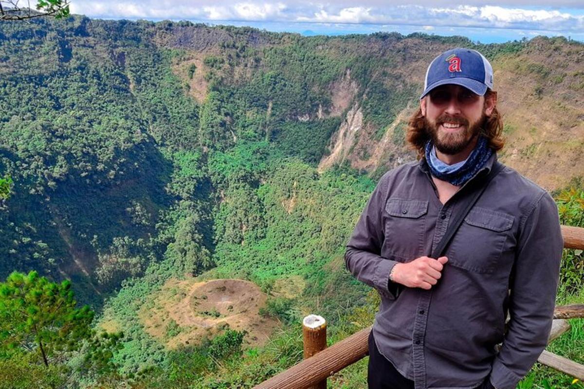 a man standing on top of a mountain