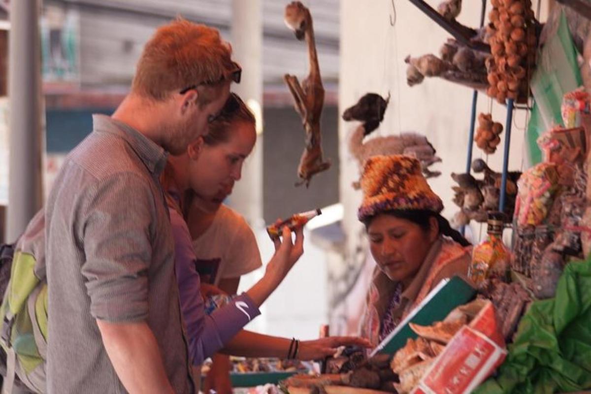 a group of people standing in a store looking at food