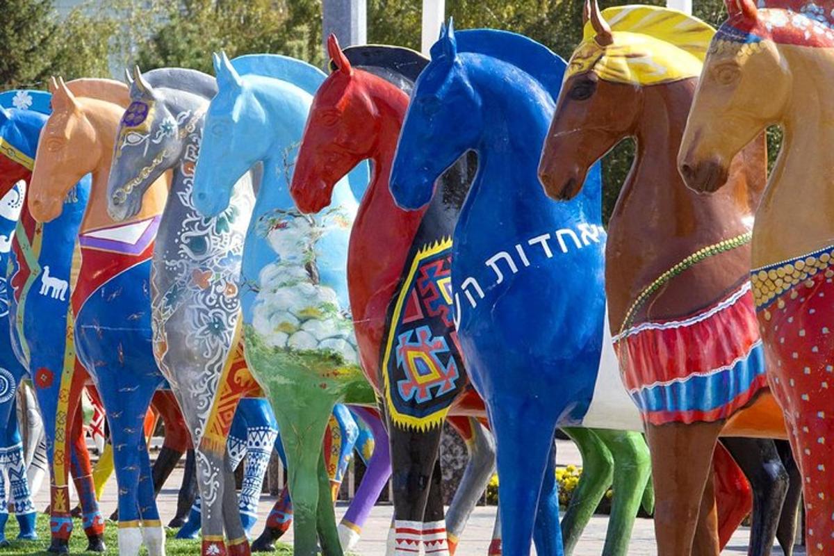 a group of colorful plastic horses in a display