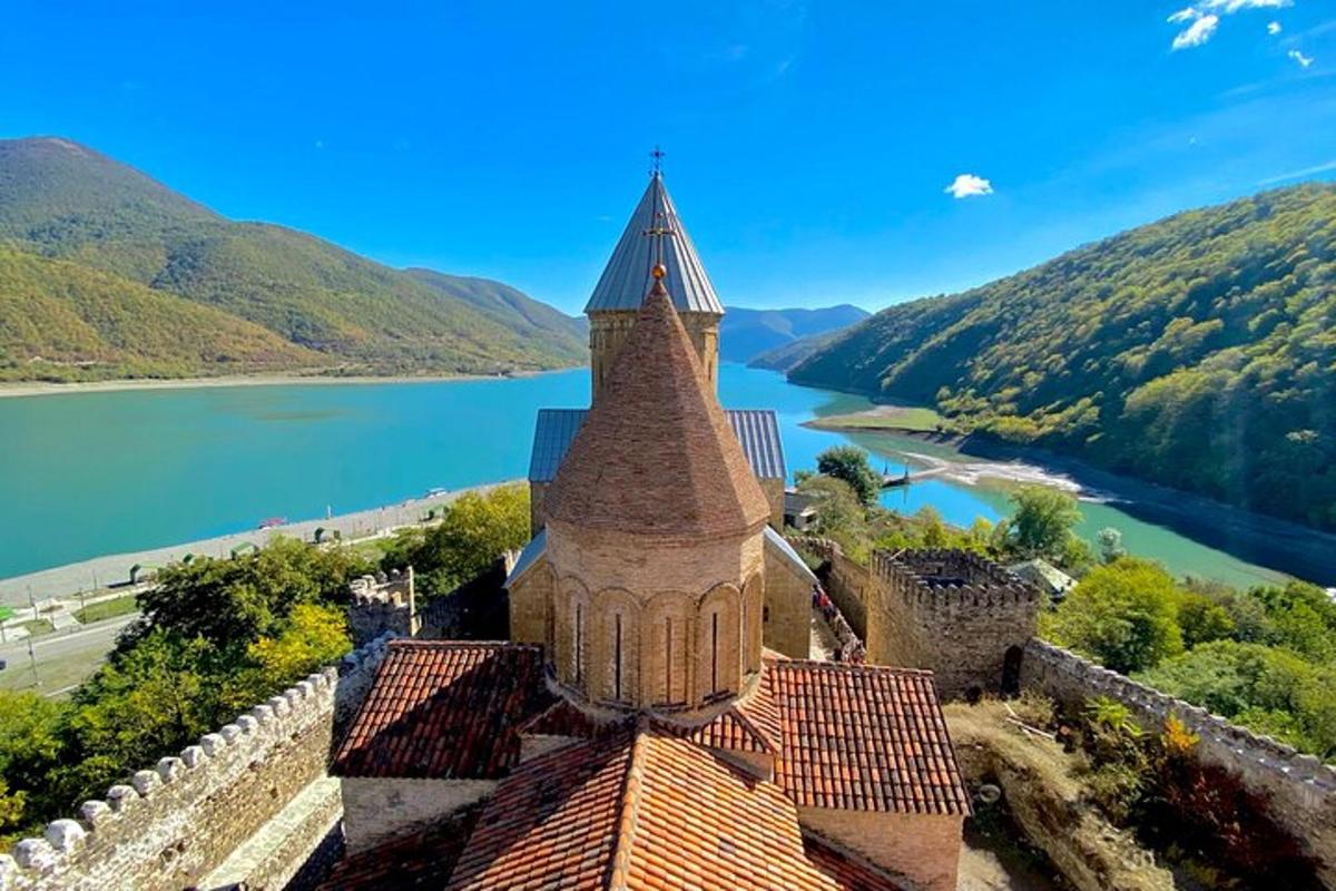 a tower on top of a building with a view of a lake
