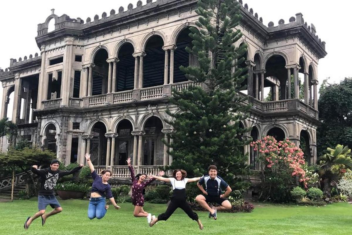 a group of people jumping in front of a building