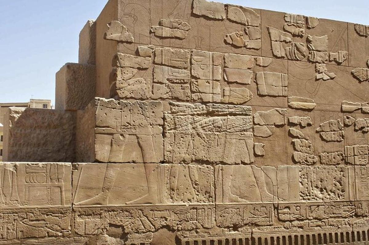 a stone wall with hieroglyphics on it