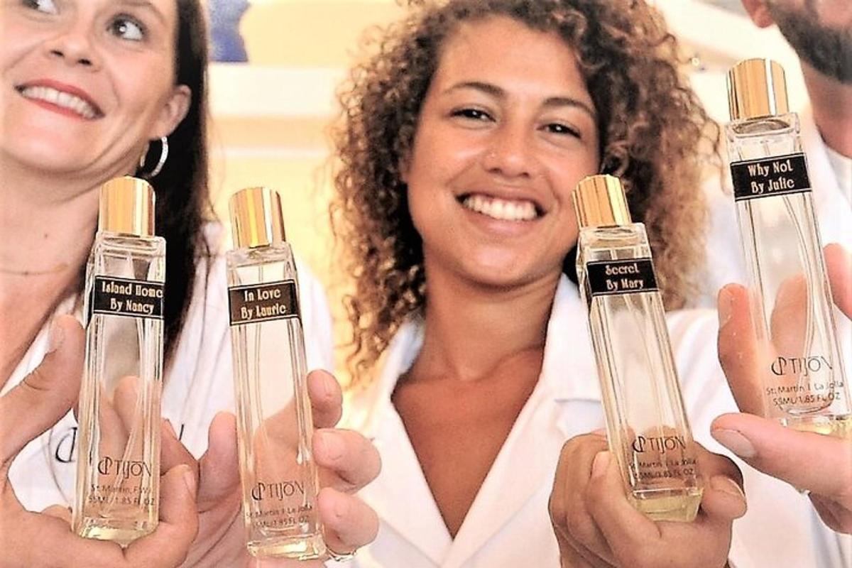 two women holding up two bottles of essential oils