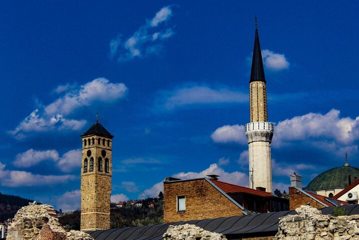 a building with two towers and a clock tower