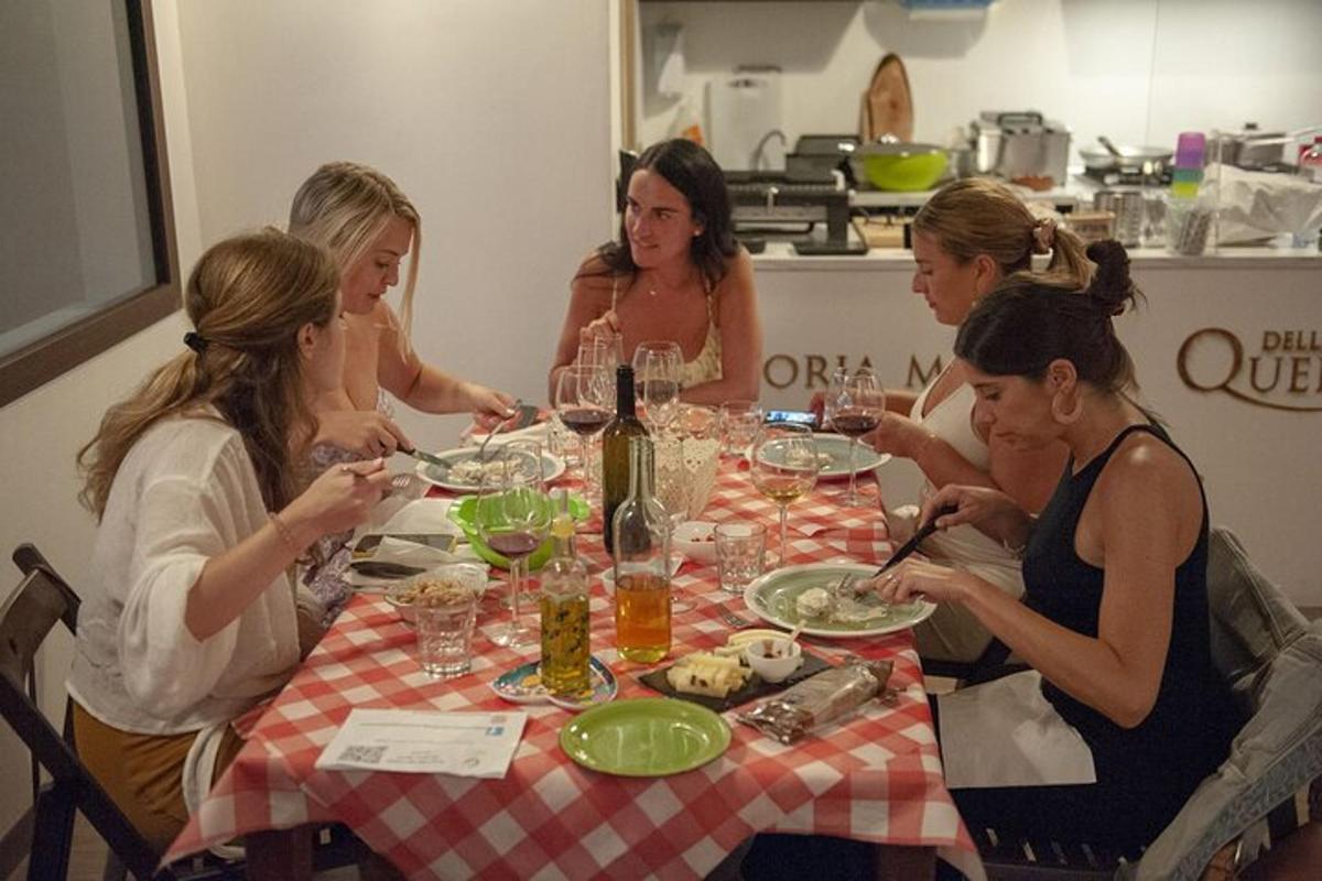 a group of women sitting around a table eating