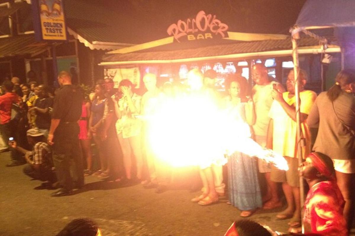 a crowd of people standing in front of a bar