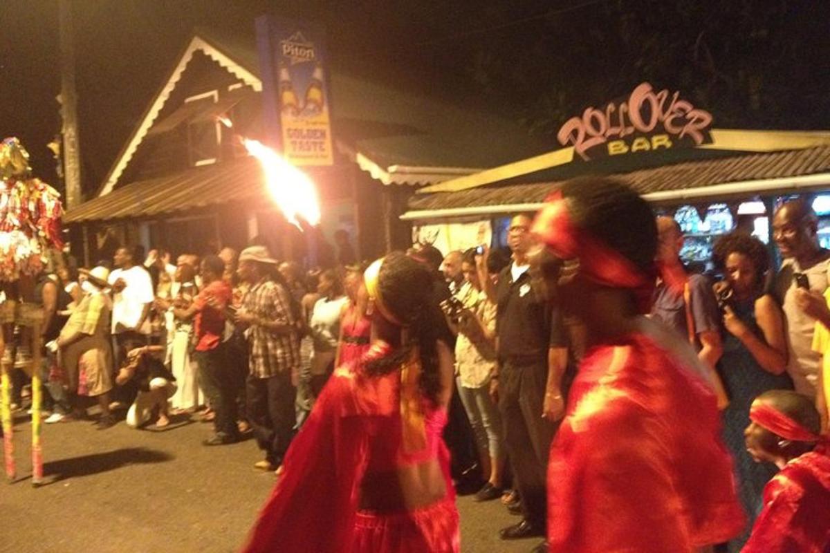 a crowd of people standing outside a bar at night