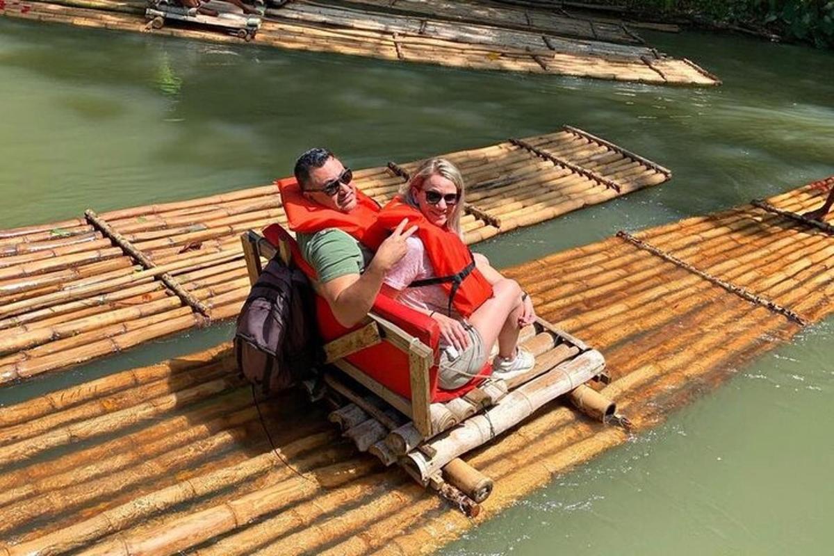 a man and woman riding on a raft in the water