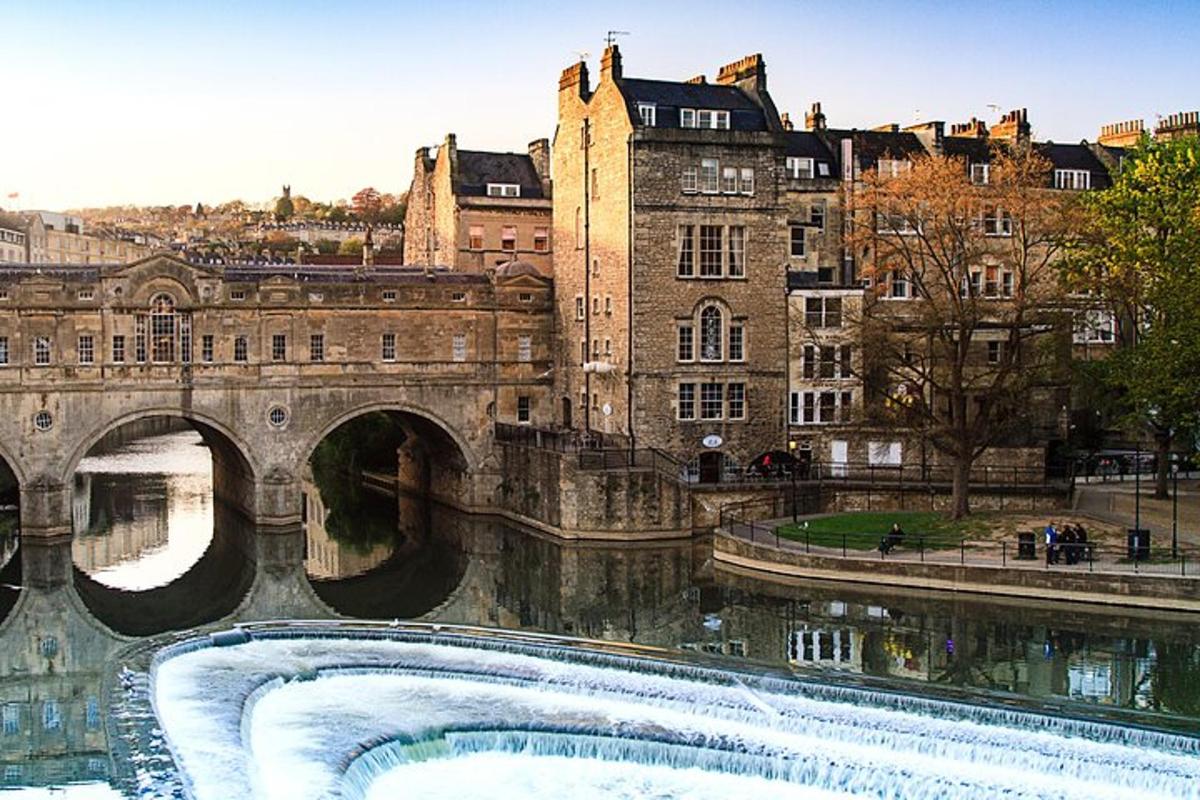 a bridge over a river in front of a building
