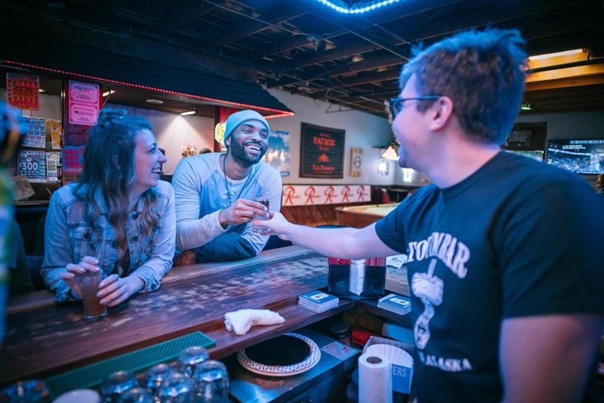 a group of people standing at a bar