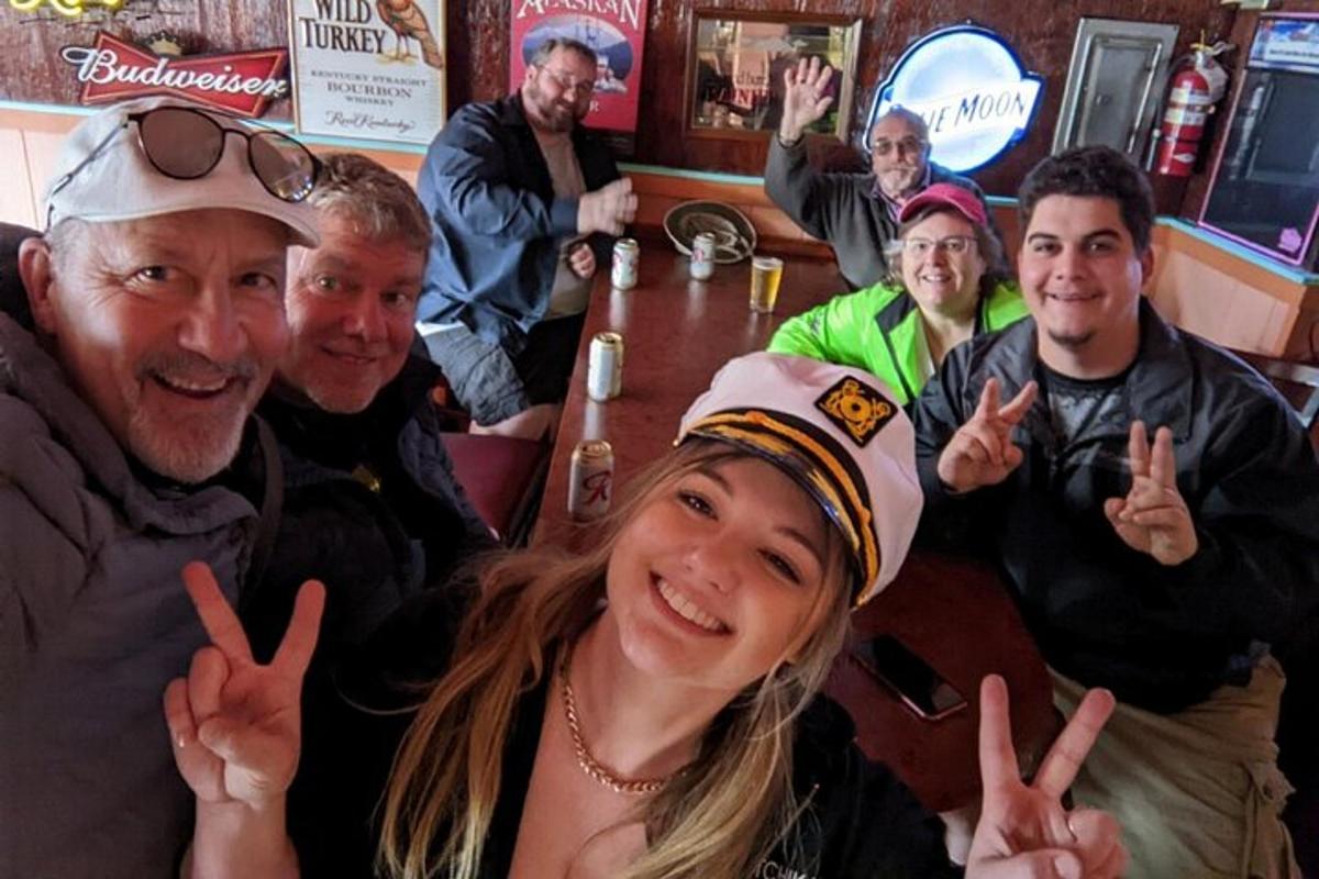 a group of people posing for a picture in a bar