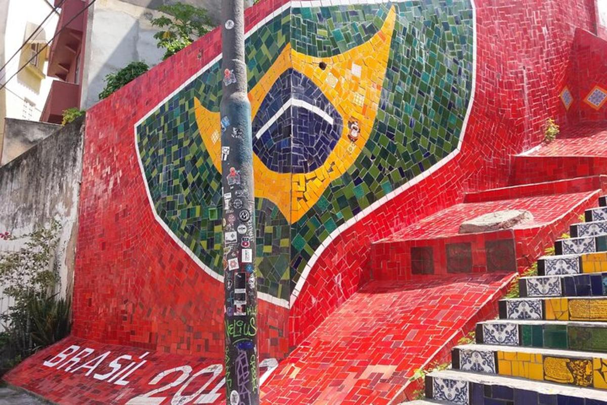 a staircase with a mosaic wall with a yellow dog on it