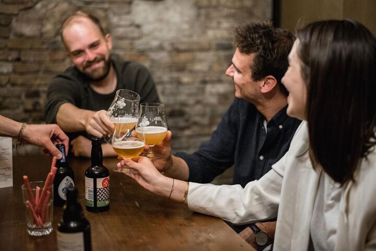 a group of people sitting around a table with glasses of wine