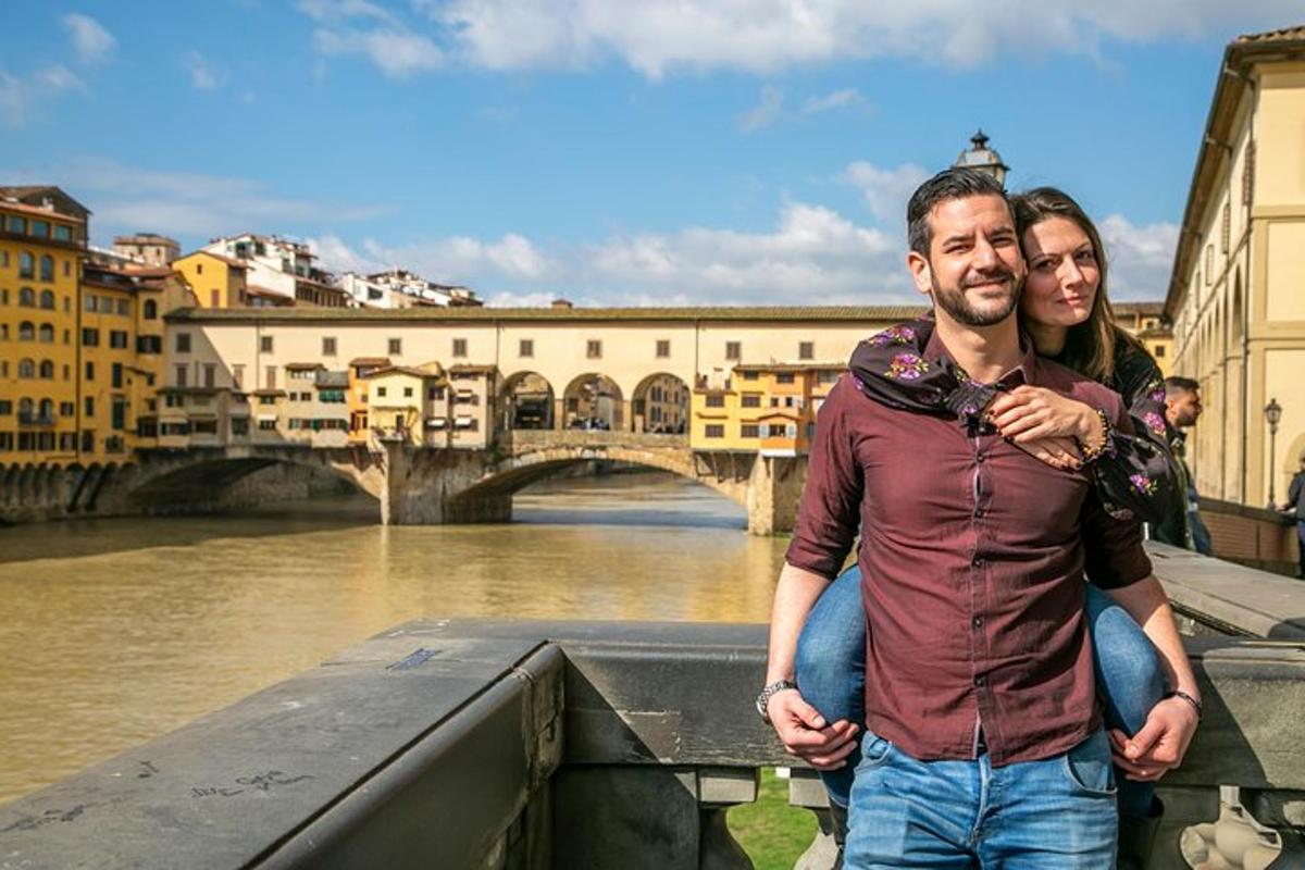two men standing next to a river with a bridge