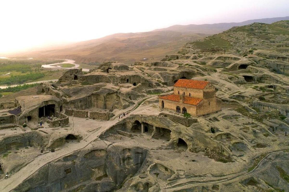 an aerial view of a building on a mountain