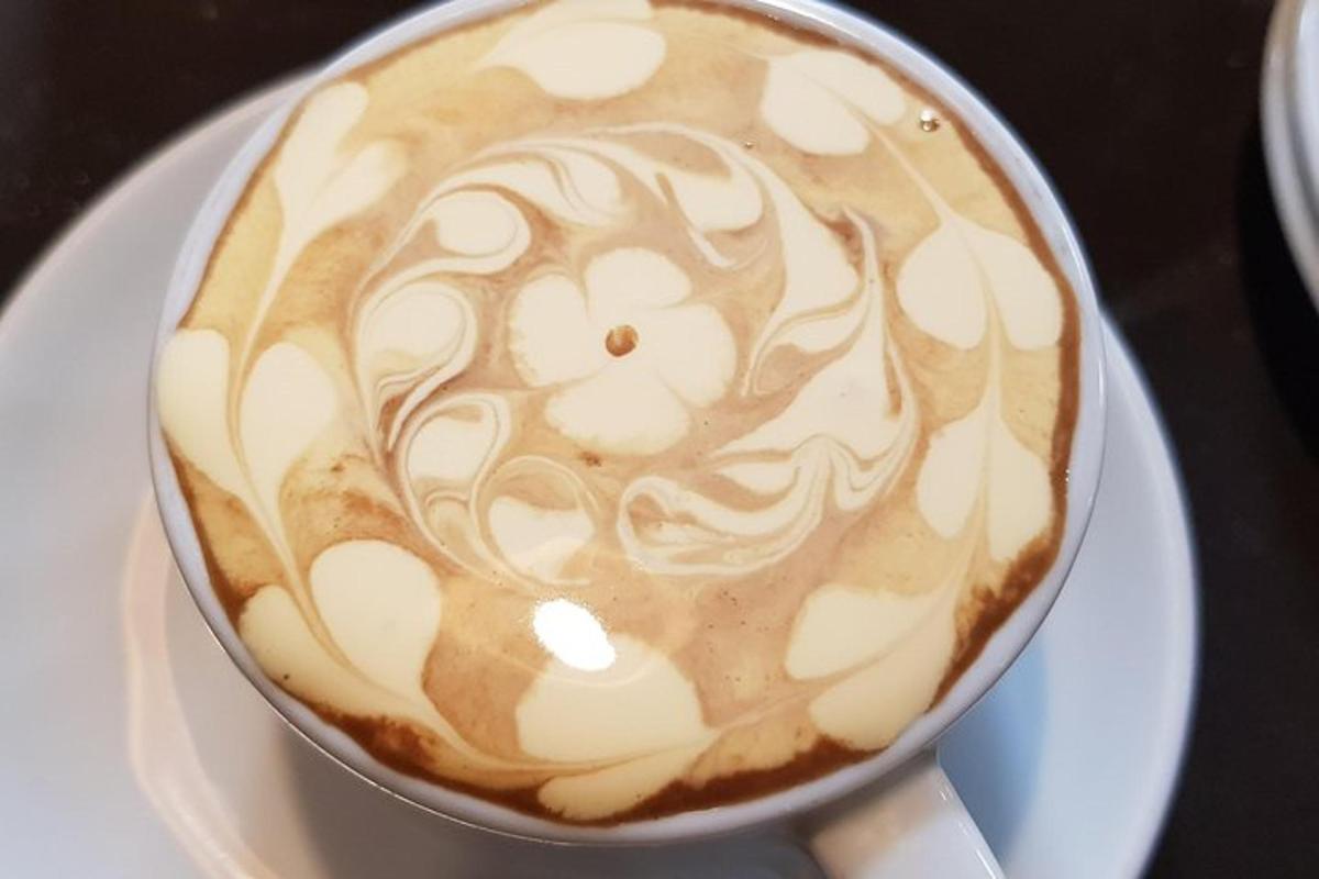 a cup of coffee on a plate on a table