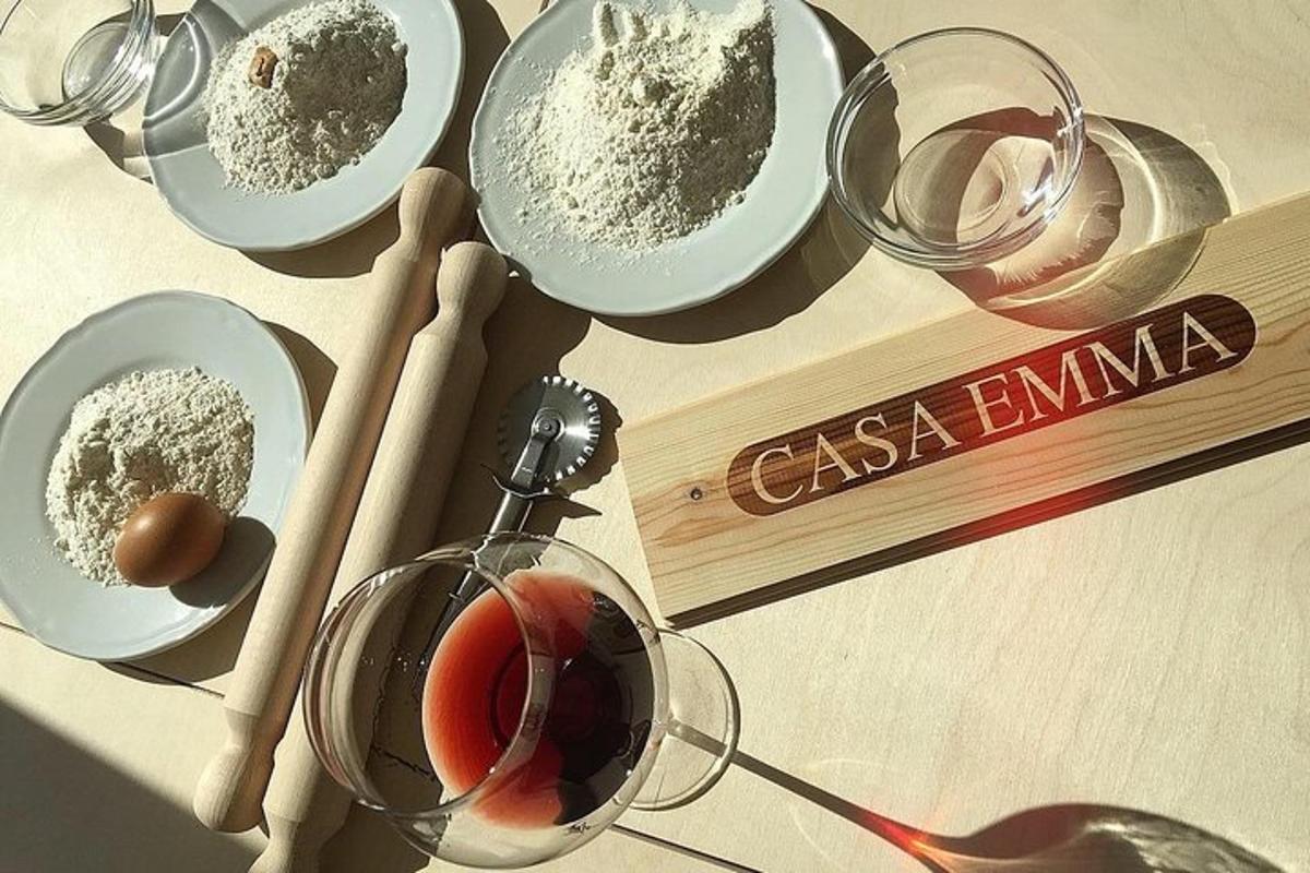 a table with plates of food and glasses of wine