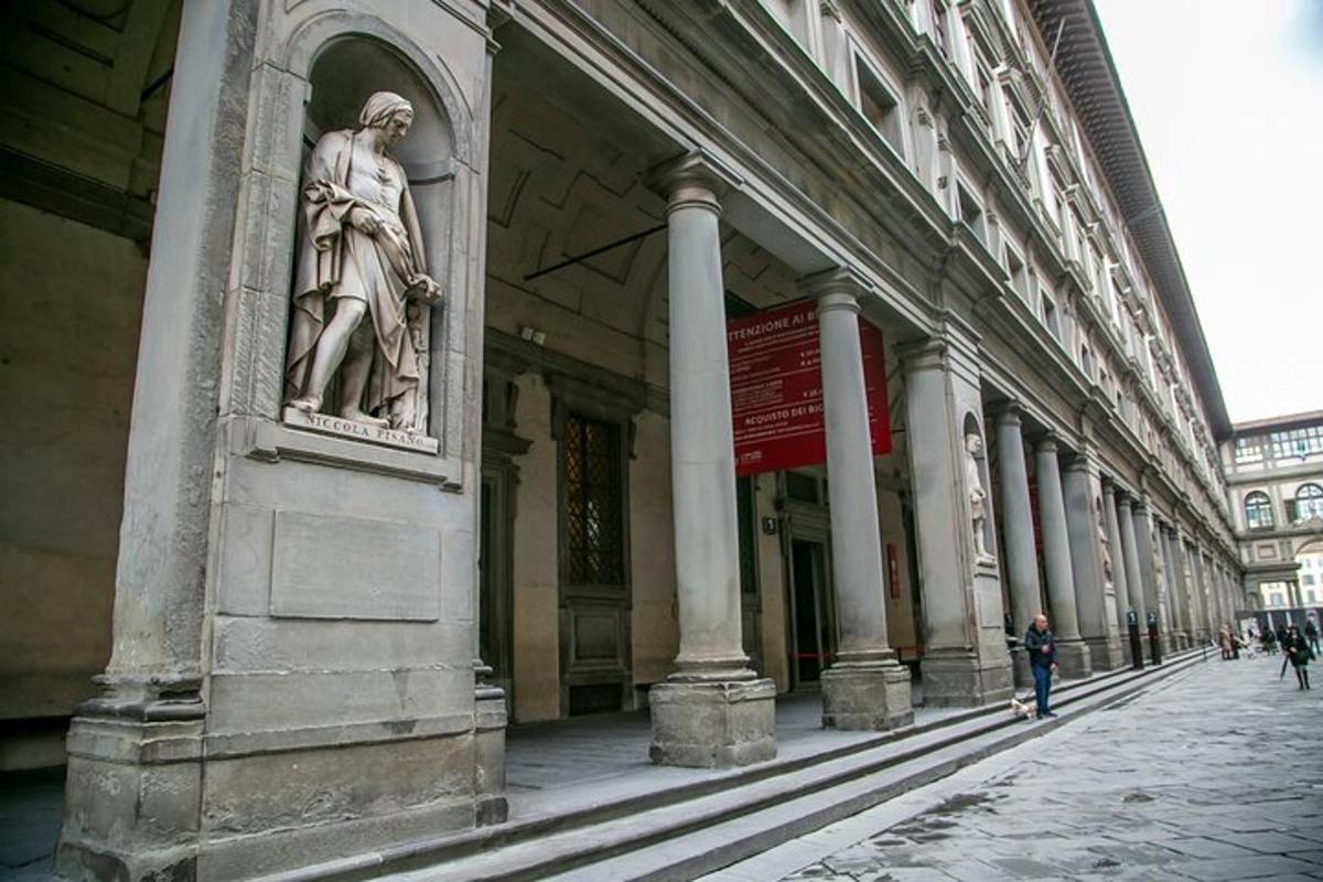 a statue of a man on the side of a building