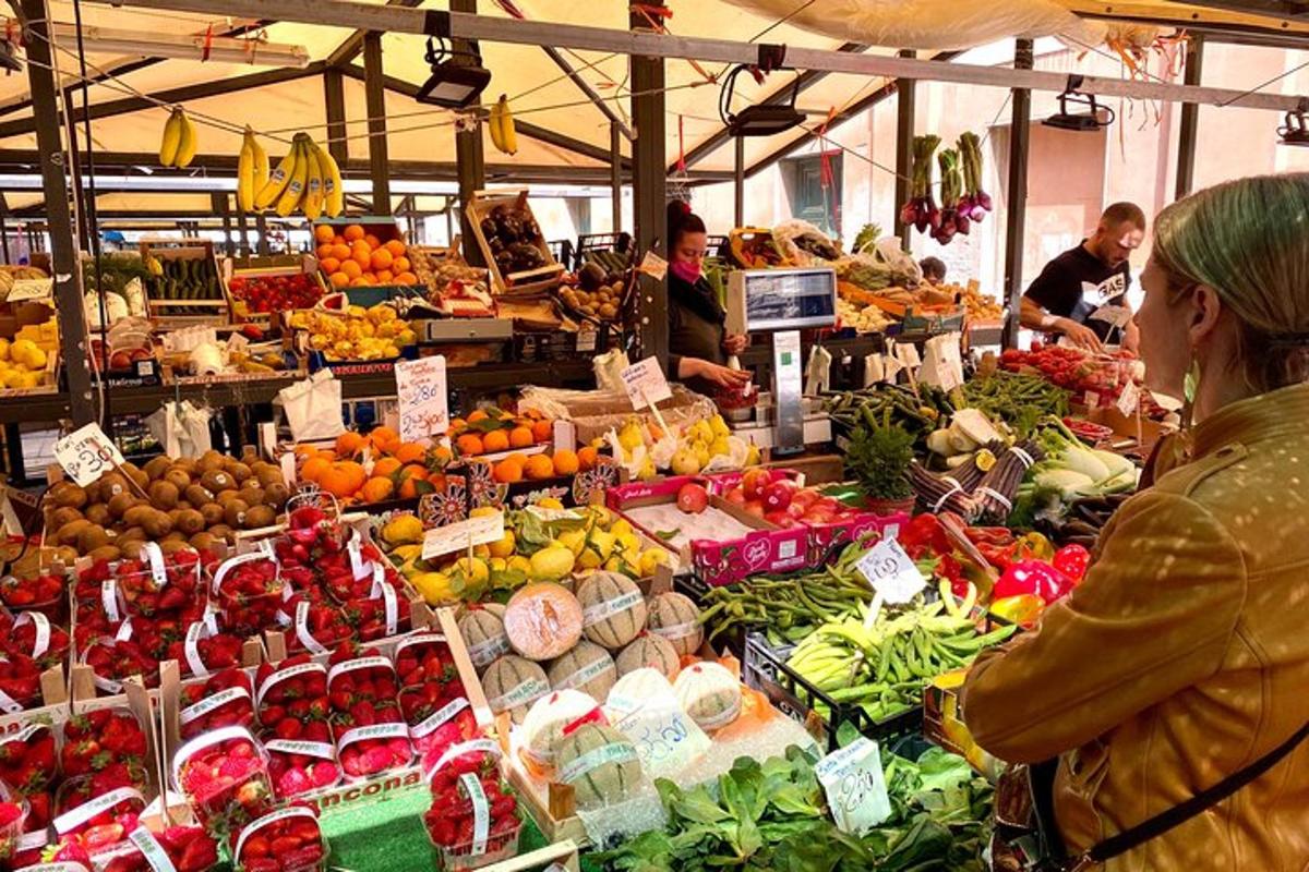 a woman standing in a market with fruits and vegetables