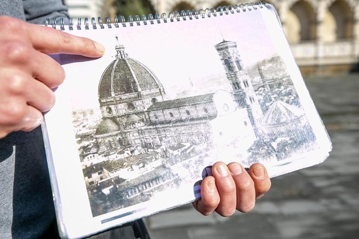 una persona che tiene in mano il disegno di un edificio