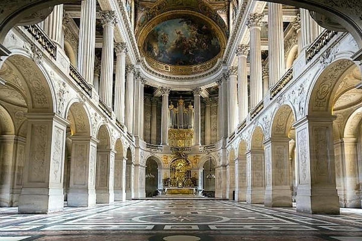a large room with a painting on the ceiling