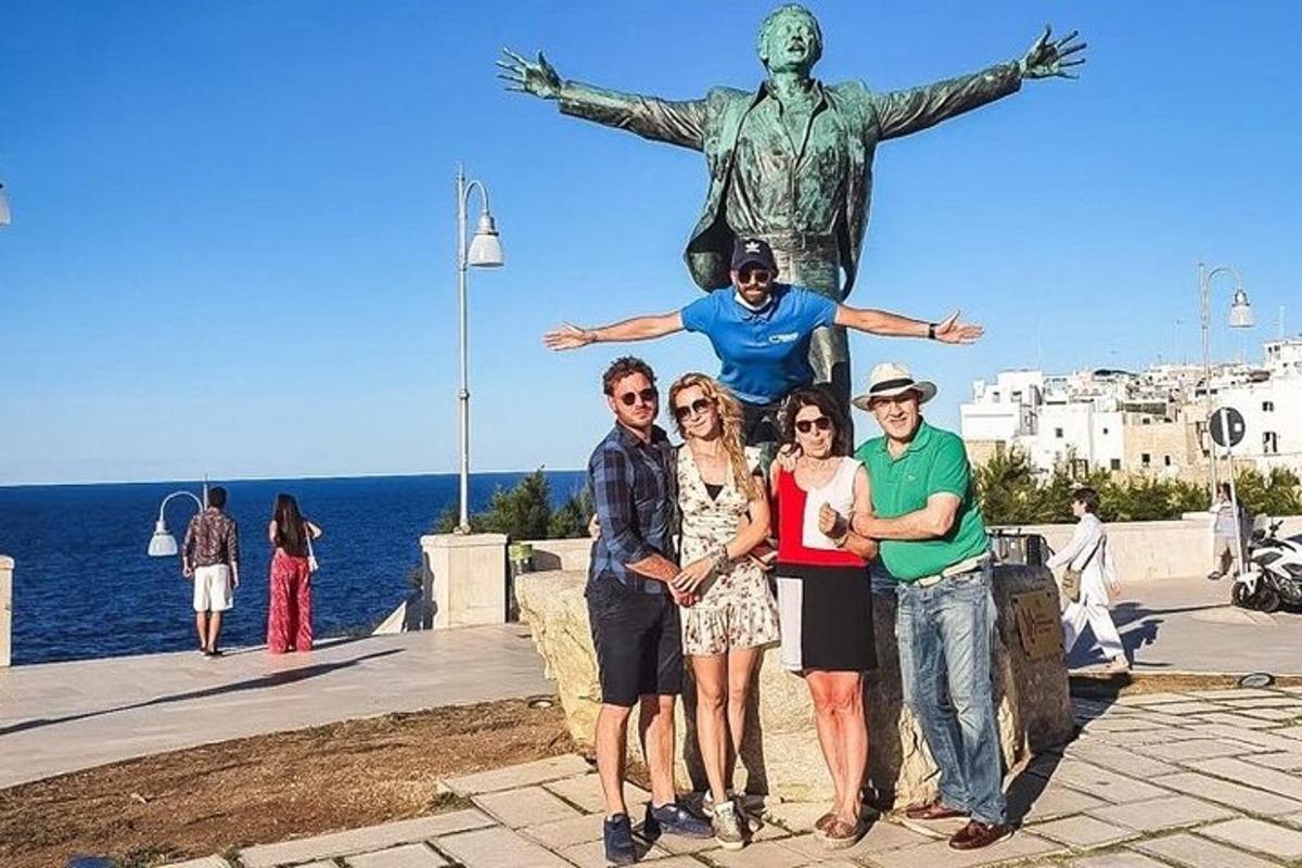 a group of people standing in front of a statue